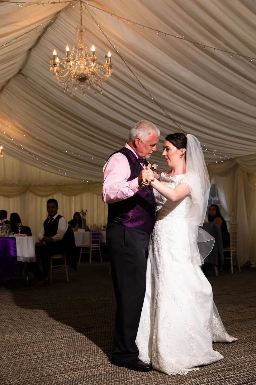 dad and daughter dance at wedding to daddy daughter songs