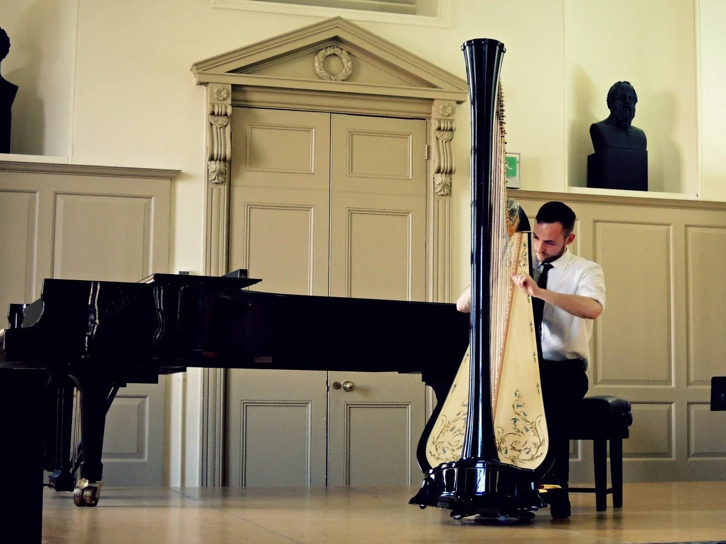 Encore harpist, Tomos Xerri playing the harp