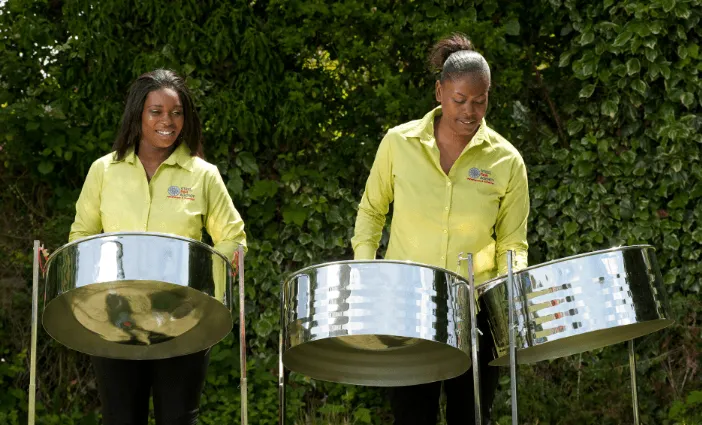 two female steel pan drummers