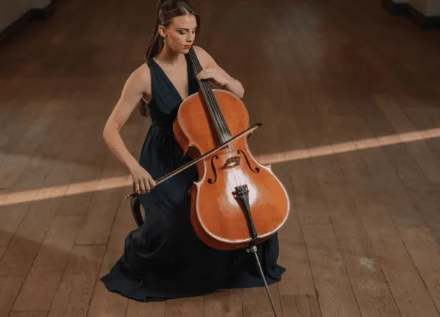 Woman playing cello in a long black dress
