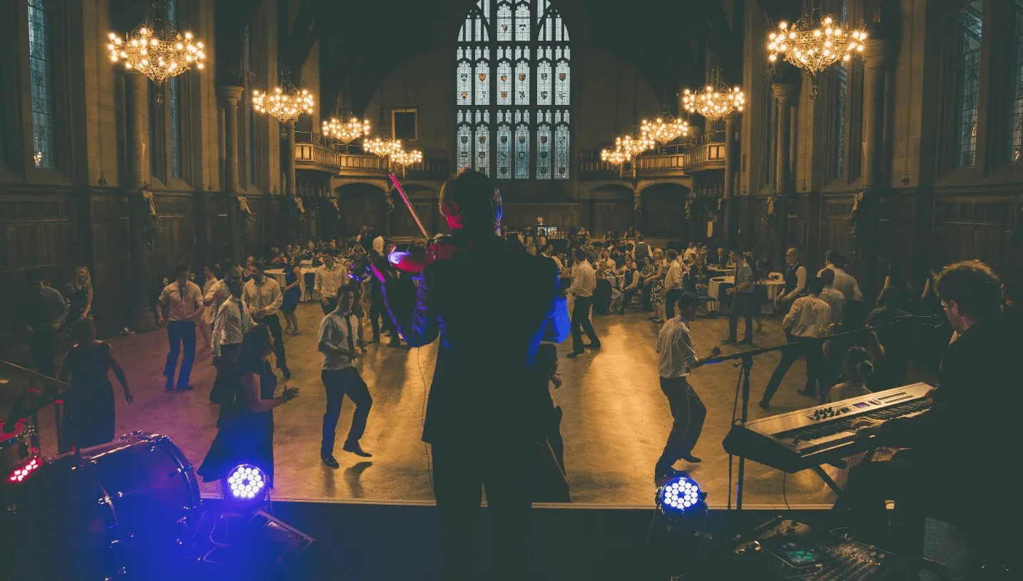 ceilidh band playing infront of a starry background 