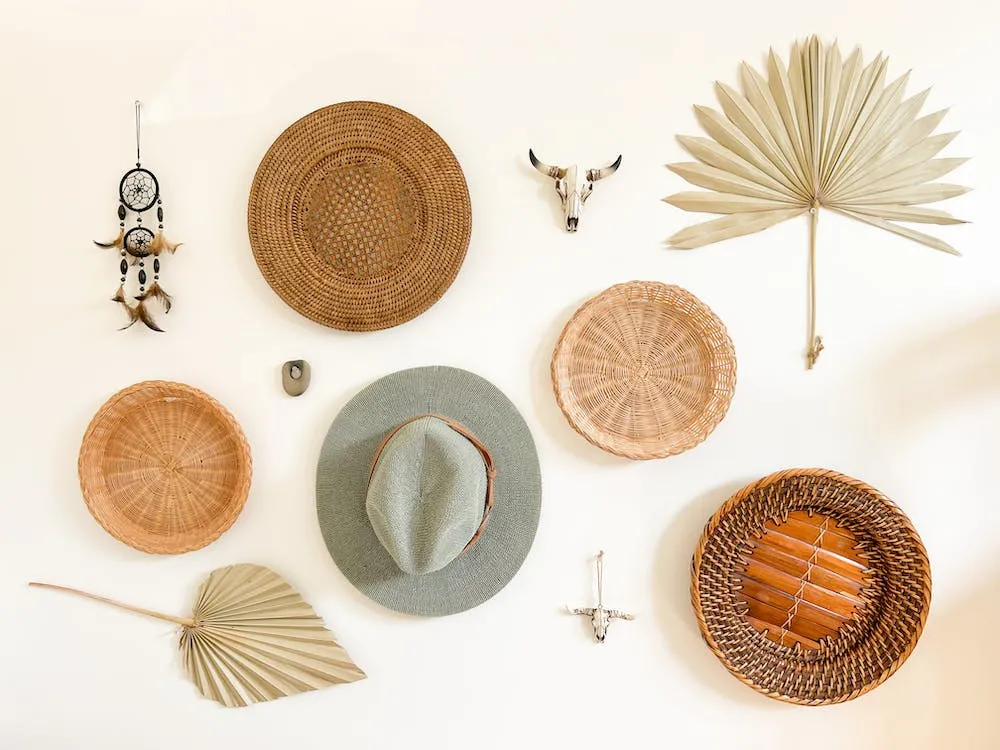 collection of bohemian themed items on a light wooden table