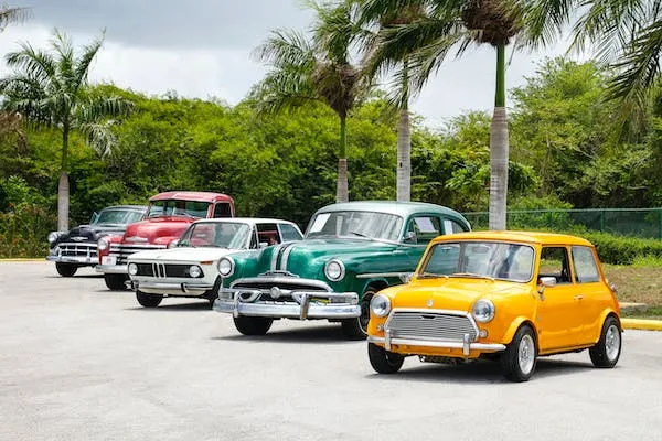 line up of four classic cars