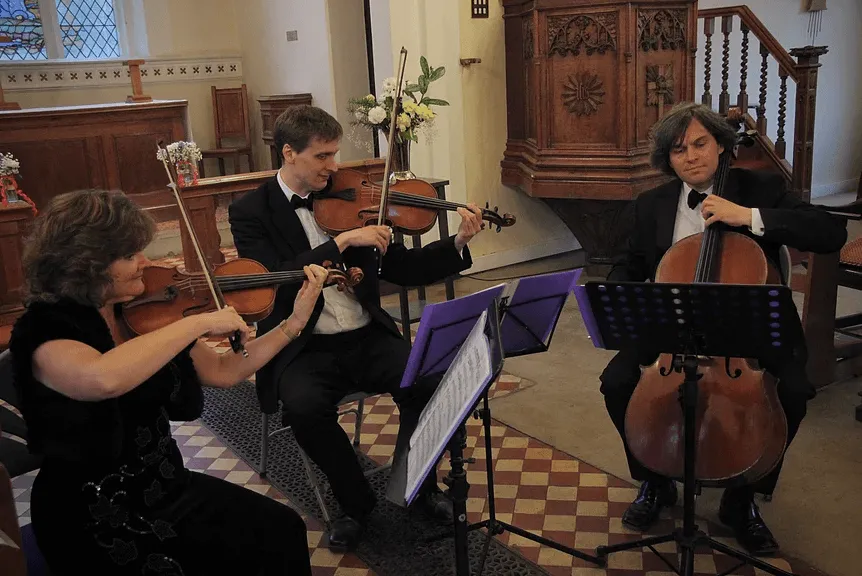 The Element String Trio playing in a church
