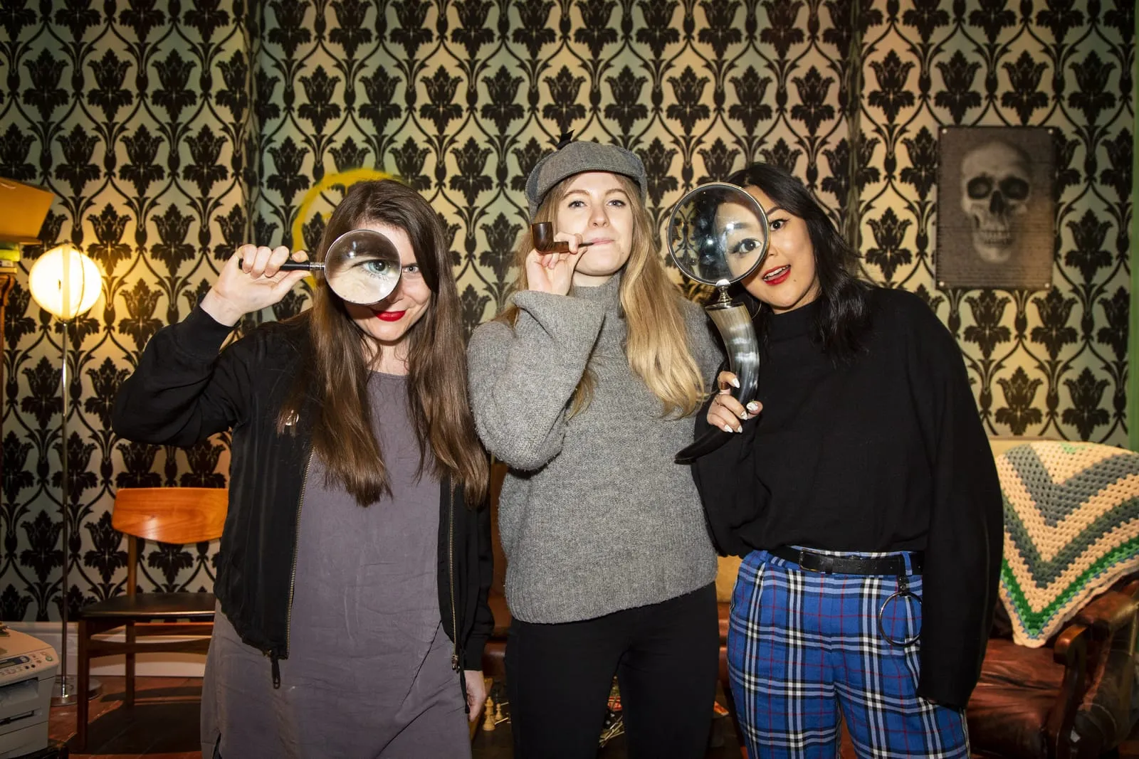 three girls playing an escape room|