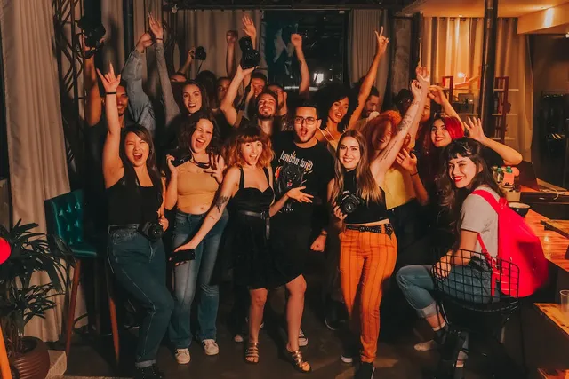 group of big friends posing for photo at a party having fun