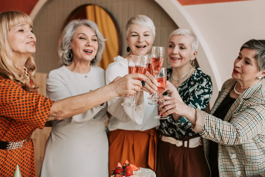 older women enjoying a 60th birthday party