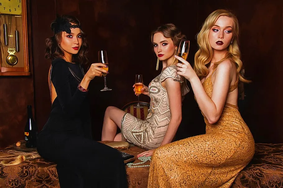 three women dressed in old hollywood glamour