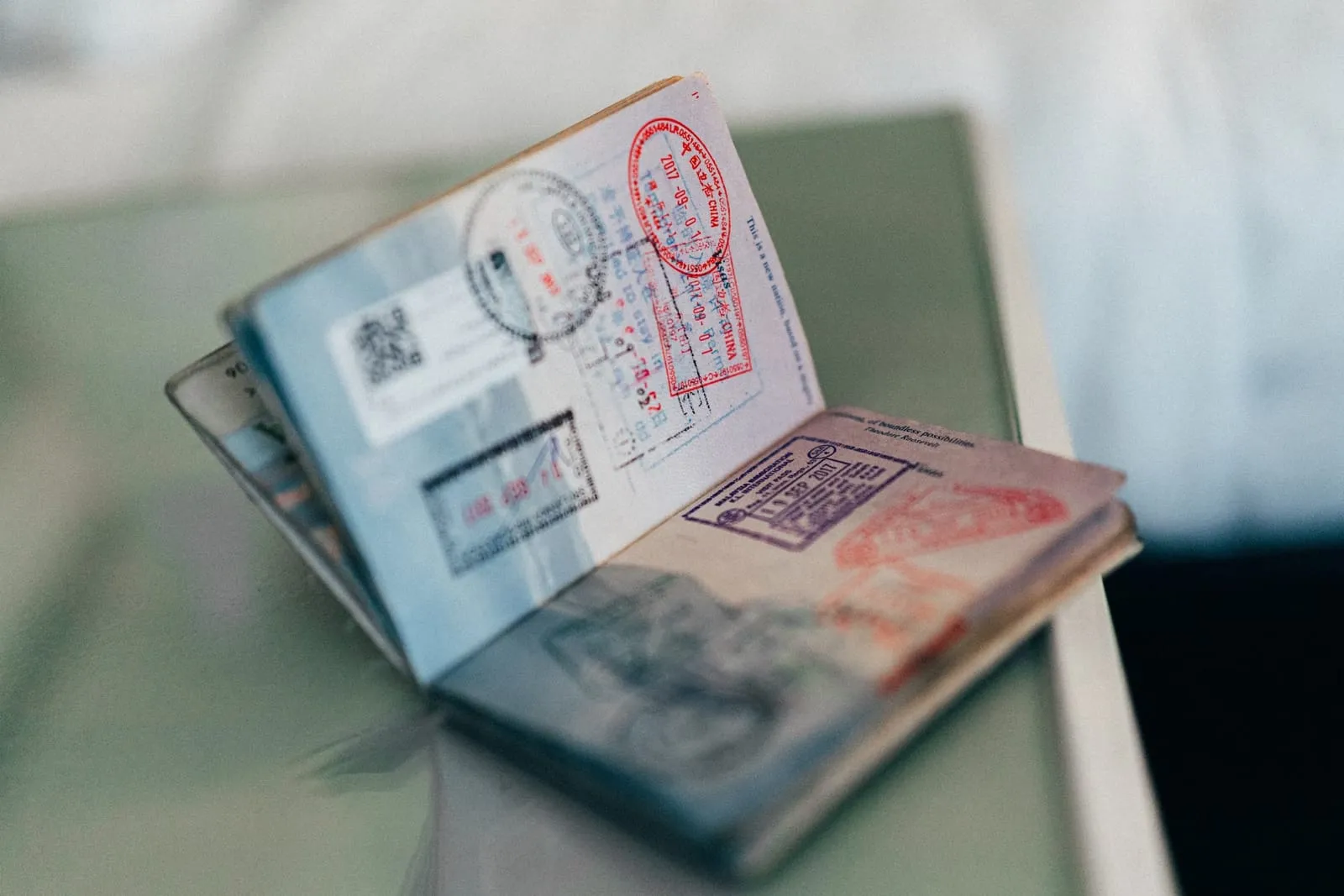close up of an open passport showing all the stamps from travel
