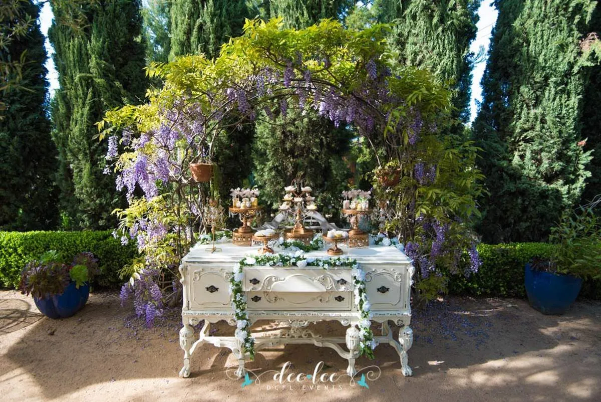vintage table decorated with flowers in a garden