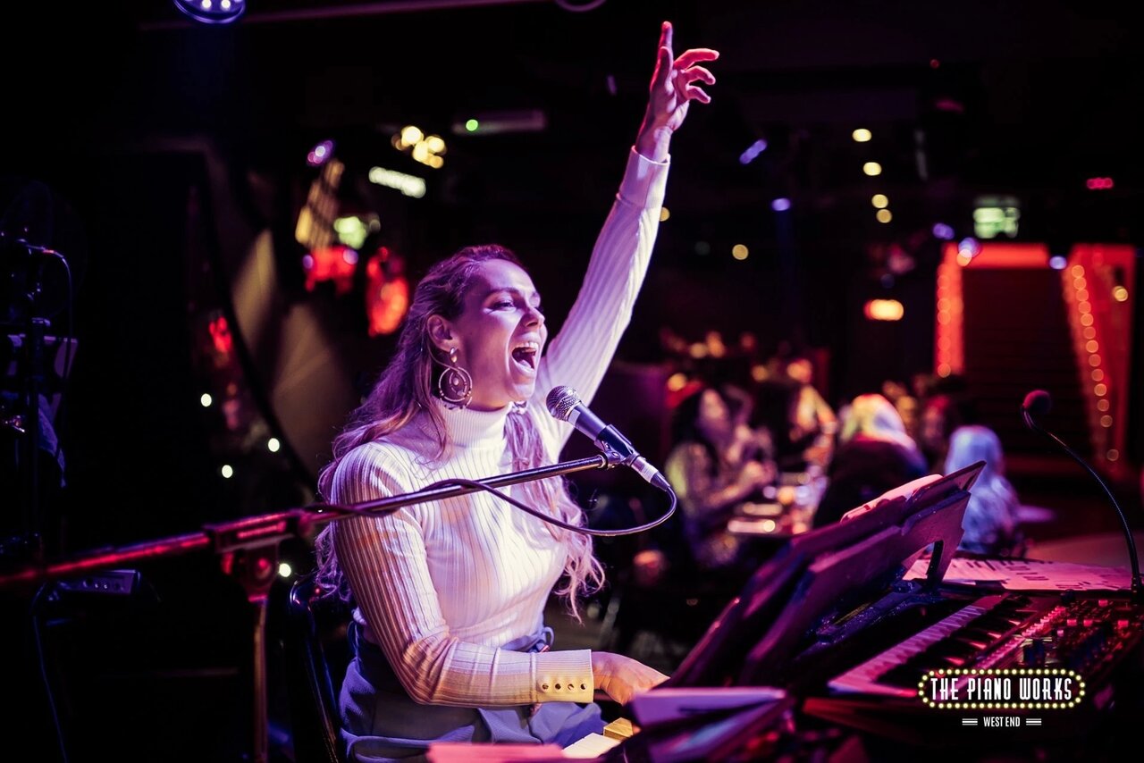 Singing pianist performing