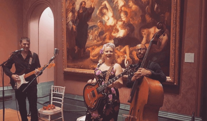 Miss Jones’ rock ‘n’ roll trio performing in the prestigious National Gallery in London.